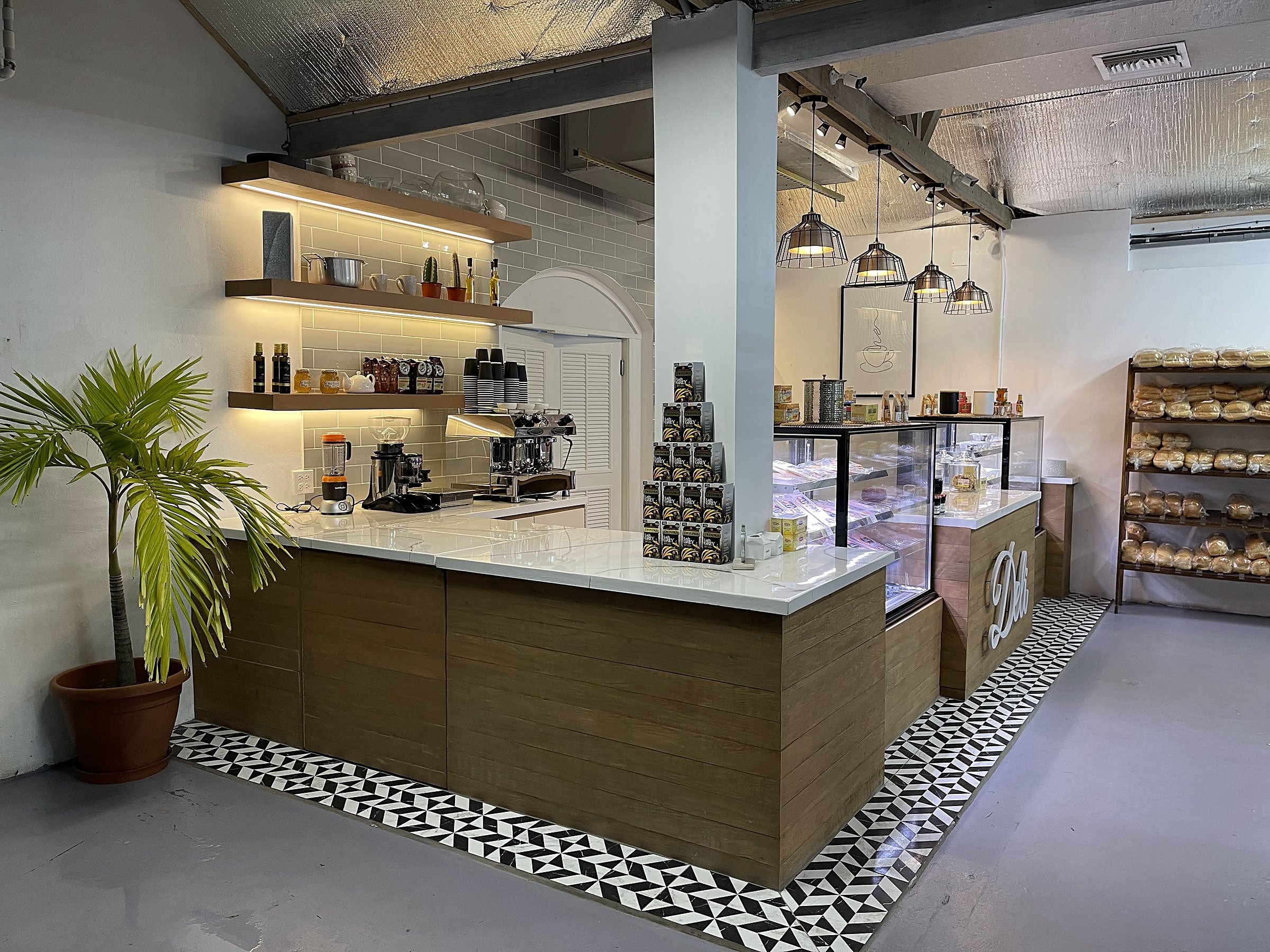 Covent Garden Deli — completed interior, full counter run with shelving and espresso station