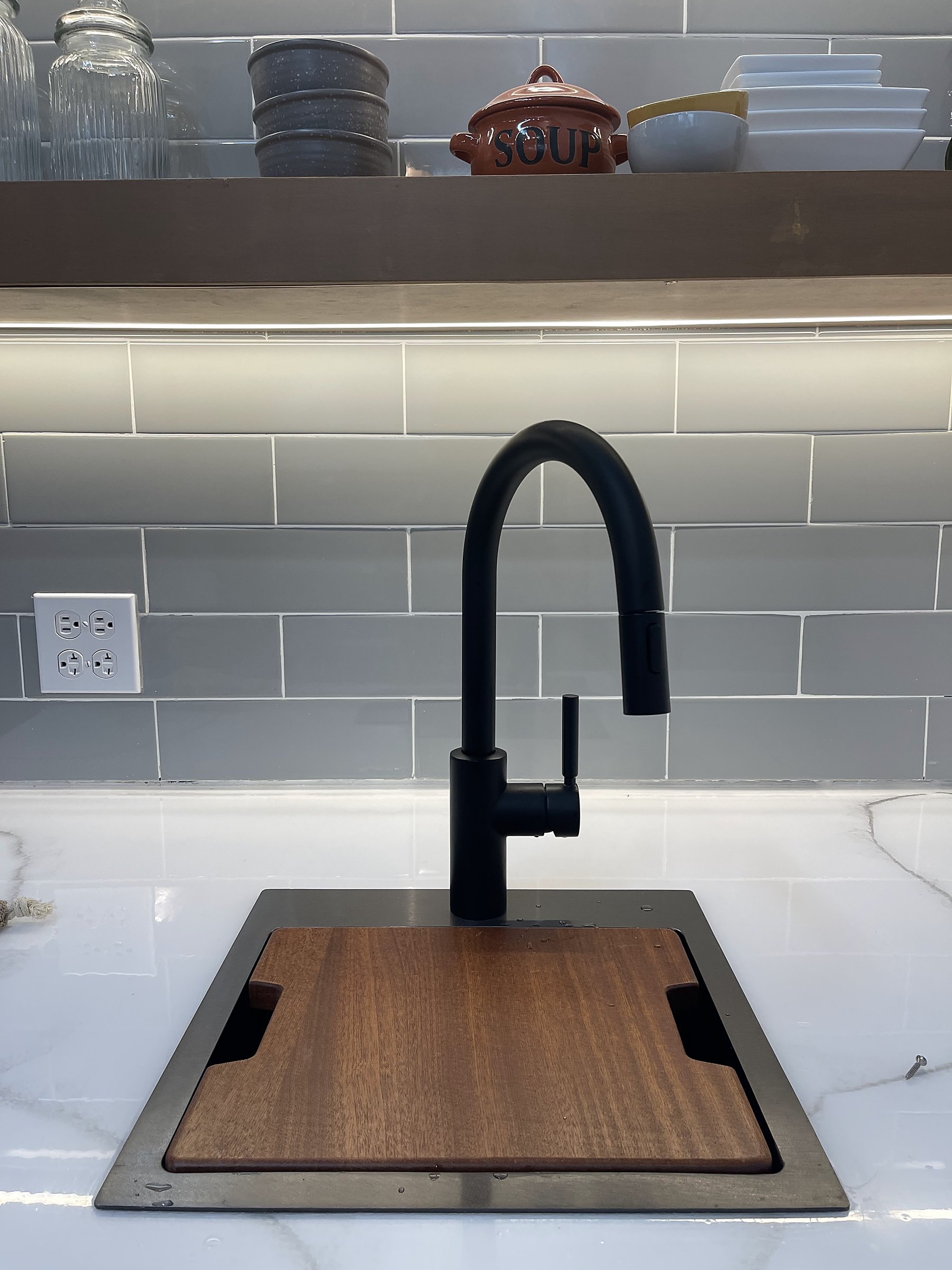 Covent Garden Deli — detail of the prep sink, tap fitting and timber cutting board insert