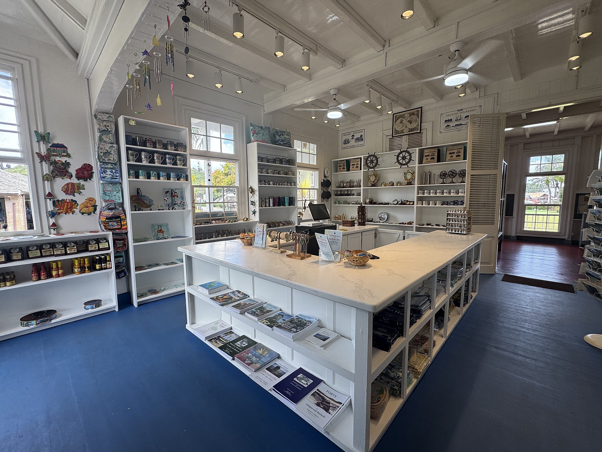 Nelson's Dockyard Gift Shop — restored interior, central counter and wall shelving