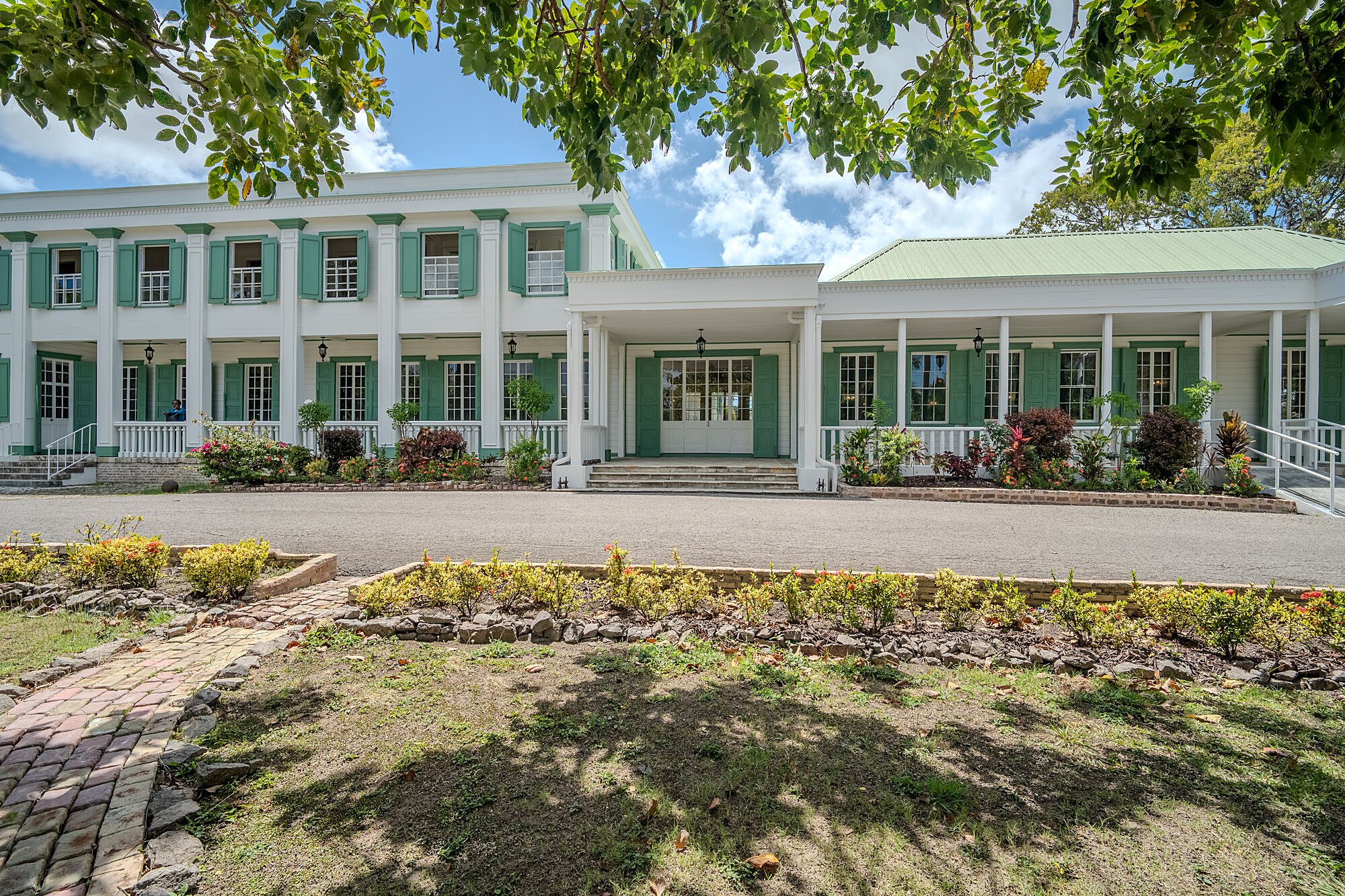Government House — principal approach and colonnade, framed by mature trees
