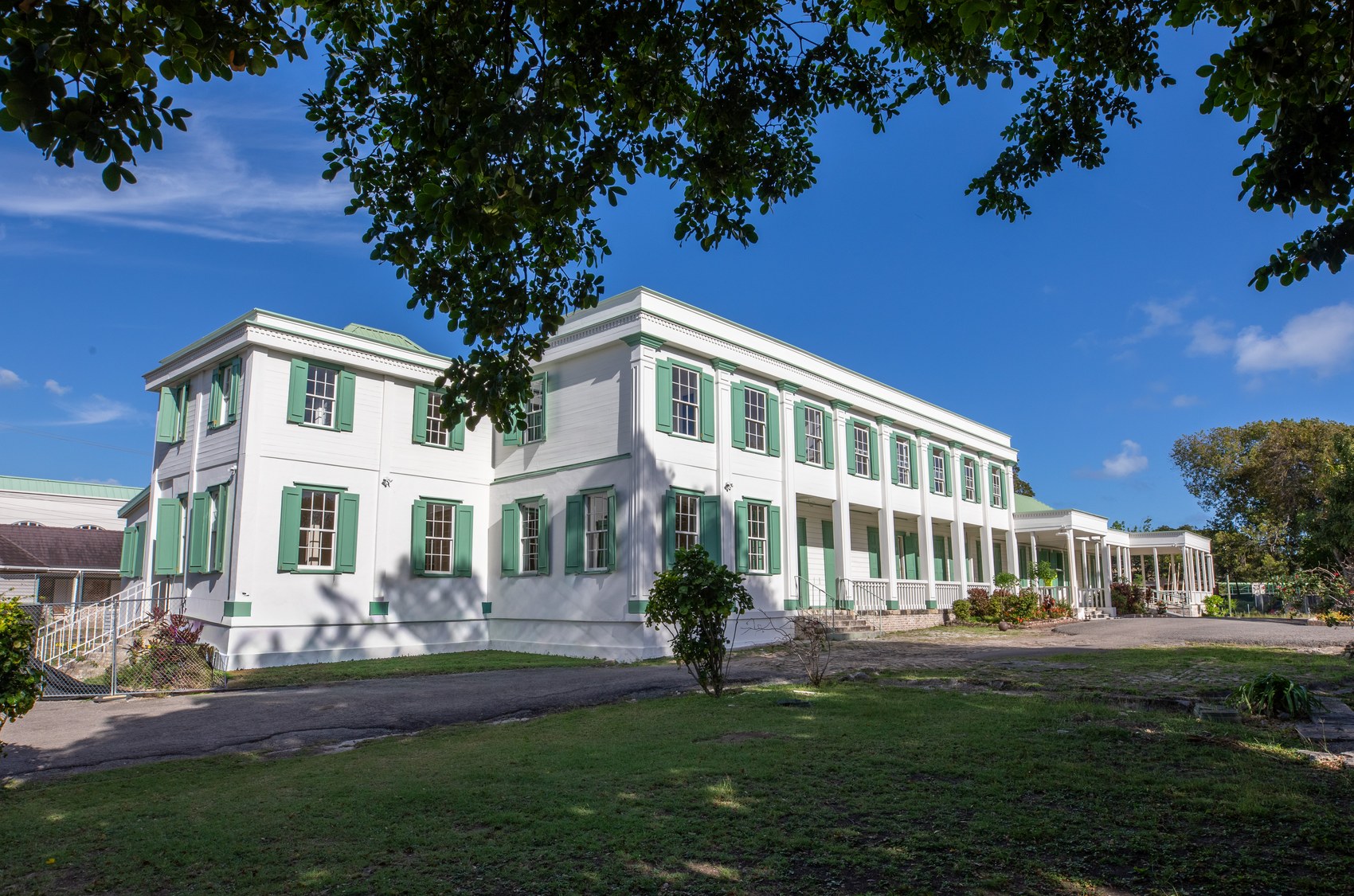 Government House — side elevation showing the colonnade, pilasters, and restored shutters