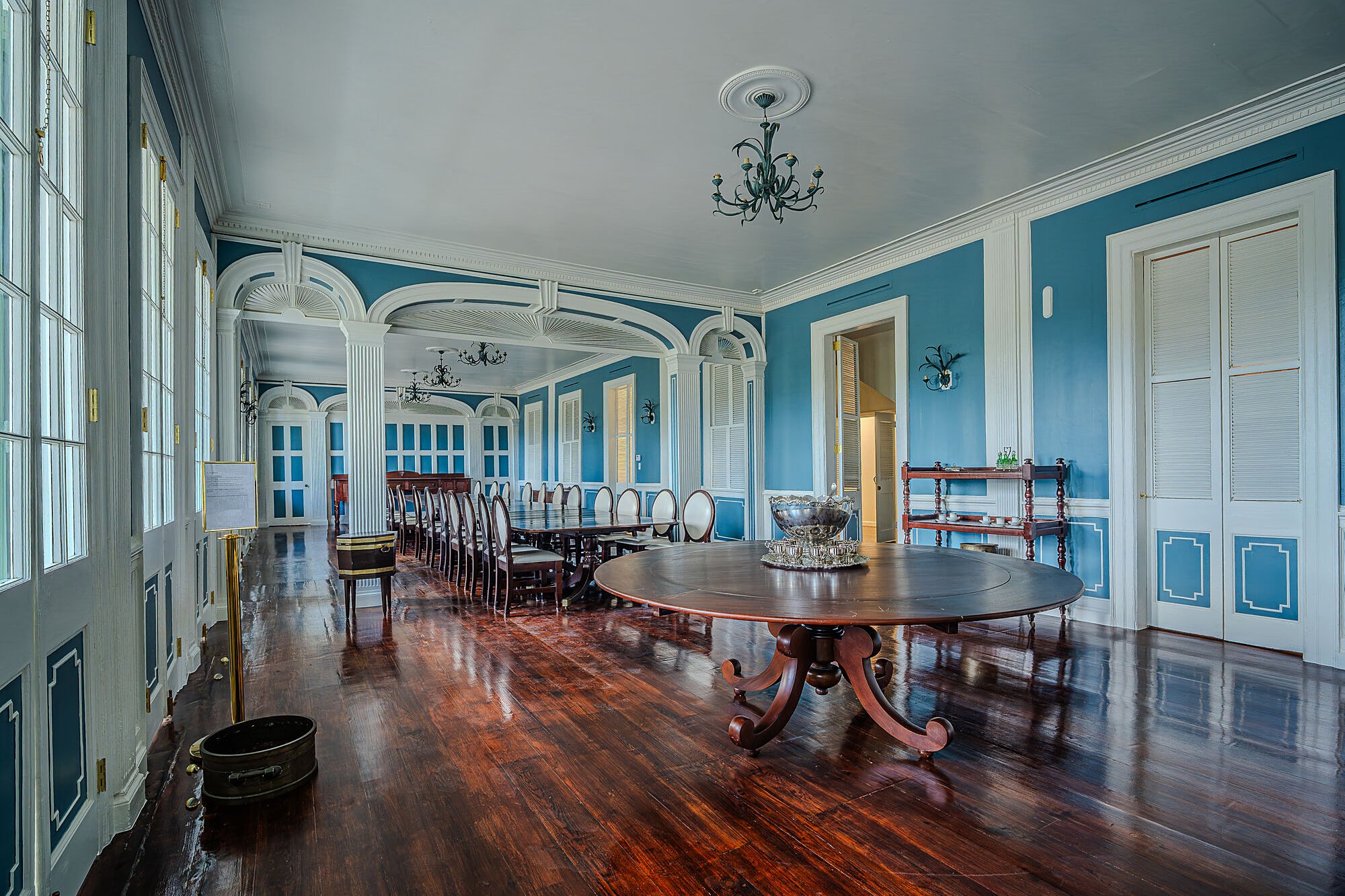 Government House — restored dining room with long table, period chairs, and original millwork