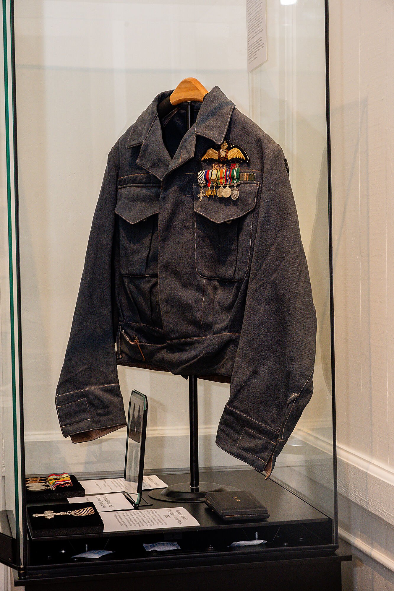 Government House Museum — wartime uniform and service medals on display