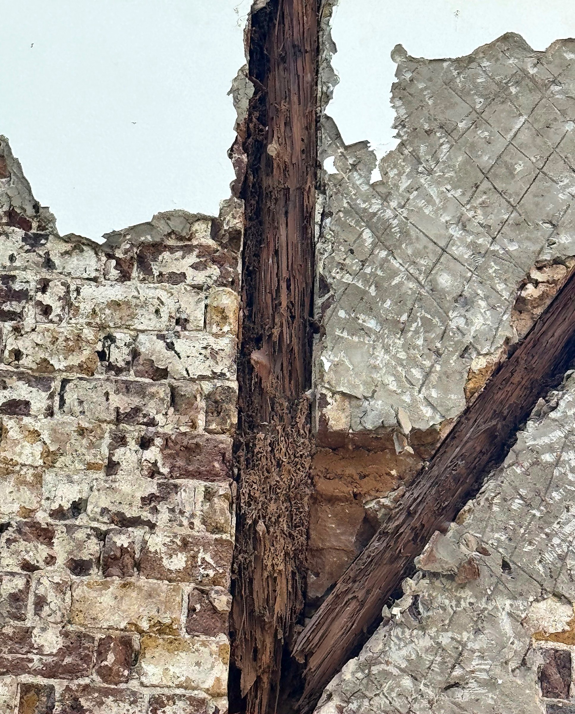 Officers' Quarters — timber rot exposed within the wall structure prior to restoration